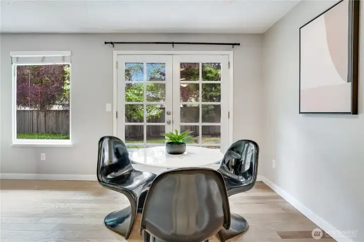 From the seating area, French Doors open to a wrap around patio