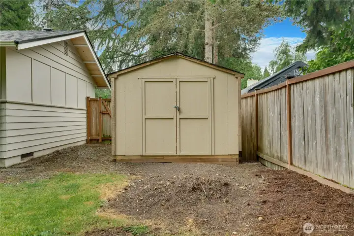 Spacious tool shed provides ample room for storage, tools, and outdoor equipment.