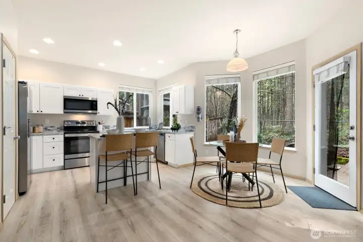 Light & bright kitchen w/brand new cabinets, countertops & flooring