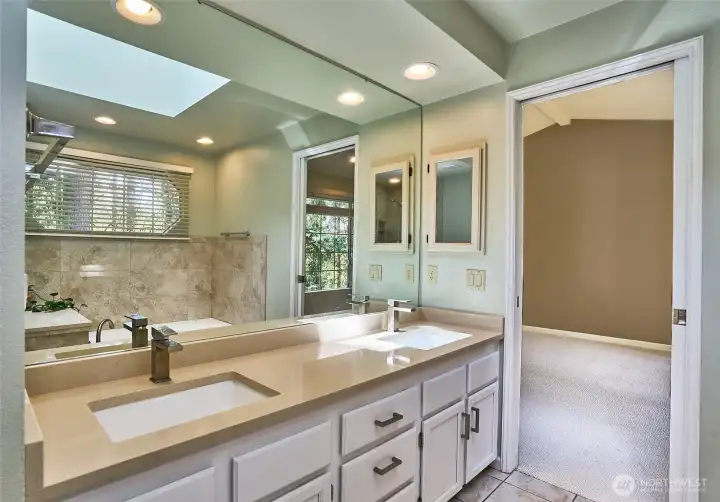 The primary en suite features double vanity with quartz counter top.