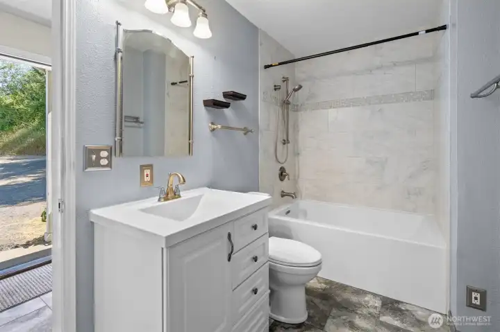 Recently updated bathroom with tile surround Recently updated bathroom with tile surround