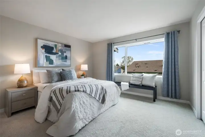 The large primary feels private and able to accommodate a king bed + side tables and sitting area or office desk. The large primary feels private and able to accommodate a king bed + side tables and sitting area or office desk.