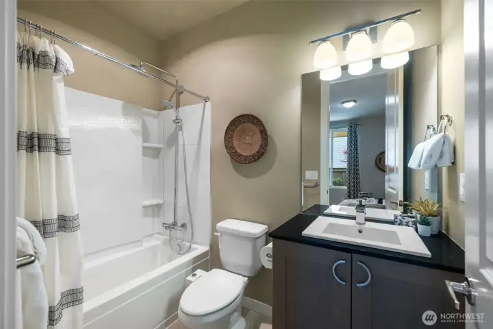 The lower level full bath with upgraded fixtures. The lower level full bath with upgraded fixtures.