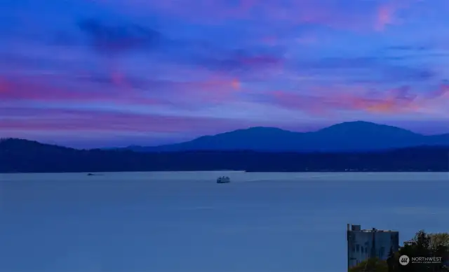That's the Seattle to Bremerton Ferry coming back to the City on an evening run with the Cascades behind it. Stunning!