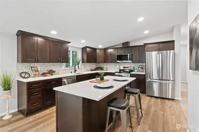 Kitchen w/New Cabinets, Quartz Counters and Custom Tile Backsplash.