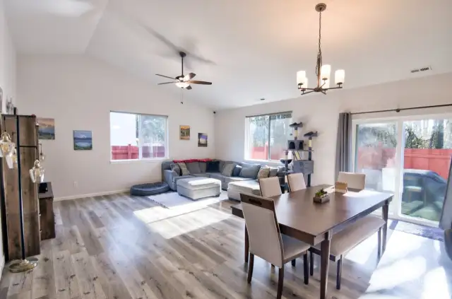 Open concept living and dining room areas.