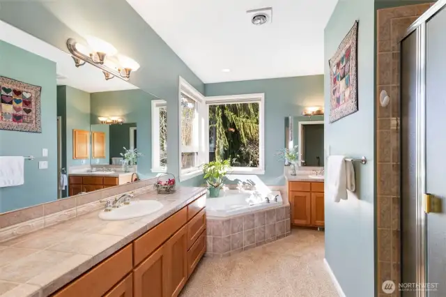 Enjoy the spa-like experience of this roomy ensuite, with large soaking tub, shower, and double vanity.