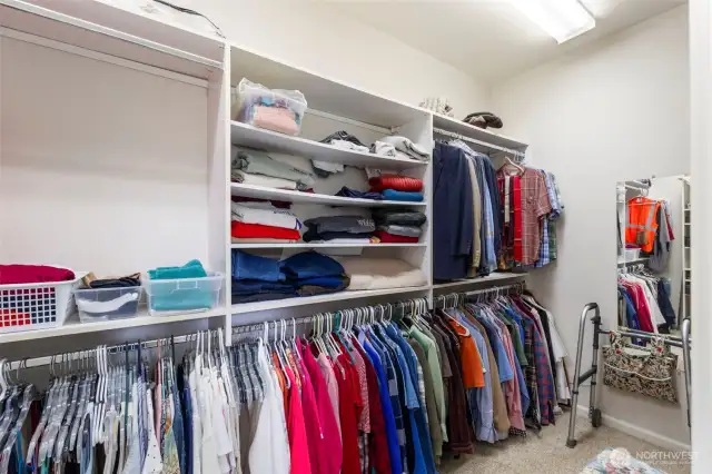 This enormous walk-in closet with tons of built-ins has room for everything!