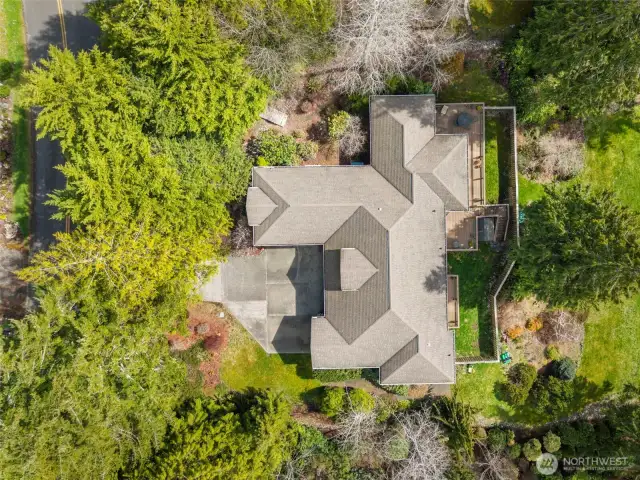 Another aerial view of the home, beautiful architecture and green spaces can be yours.