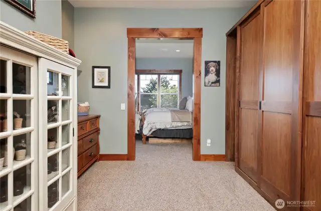 Primary closet with custom cabinets