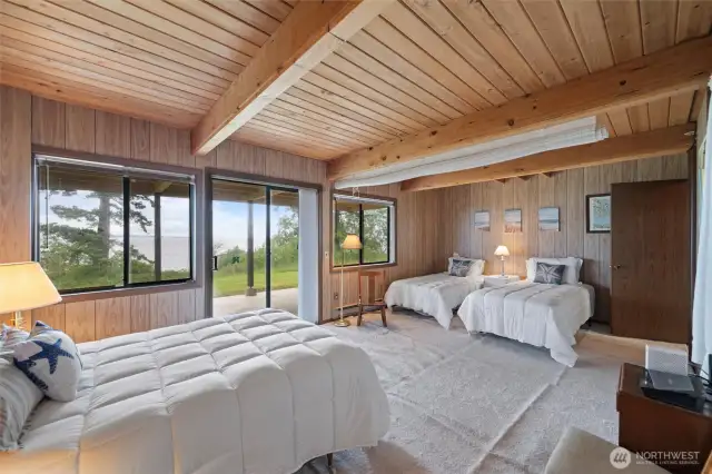 a fantastic walk out great room that is currently used as a combination guest space but could be easily turned into any configuration you can imagine.