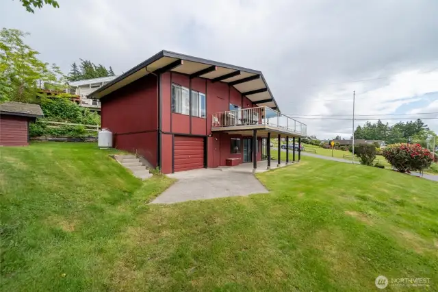 a one car garage (currently in use as a workshop) can be accessed from W Shore Drive and used as a garage as well.