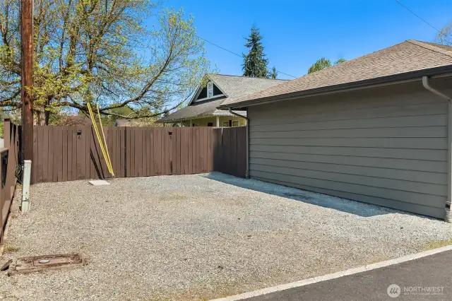 assigned uncovered space is closest to garage and includes extra space behind garage for additional storage