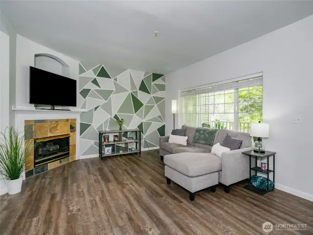 Welcome home! Gas fireplace and a custom wall treatment make this a unique home.