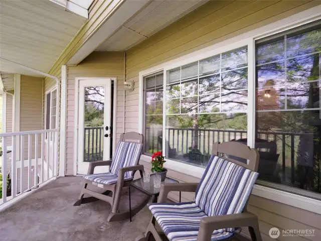 Large patio looks out to golf course and open space.