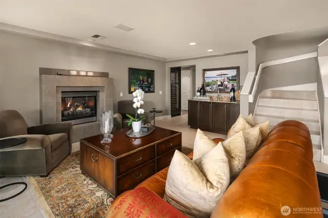 The bonus room sports a welcoming fireplace and a wet bar with a Sub-Zero wine refrigerator nearby.