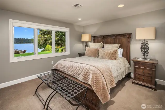 Guest room with dreamy lake and garden views.