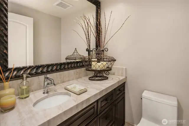 An additional powder room on the lower level.