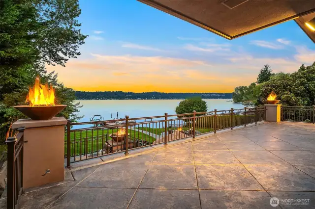 WOW! Custom everything! Pressed concrete covered deck with hand forged wrought iron railings with fire bowl accents. Talk about perfection realized!