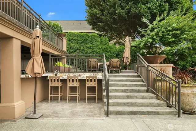An entertainment bar off of the outdoor kitchen and one of several venues for the best in al fresco living.