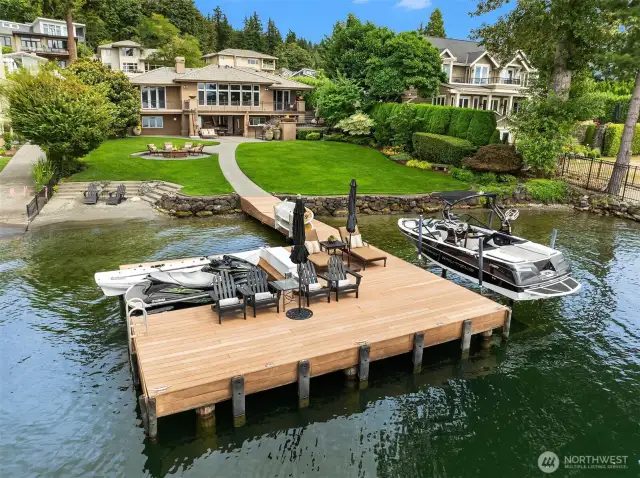 Private, pristine waterfront oasis with 100' of no bank waterfront with sandy beach and private boat launch.