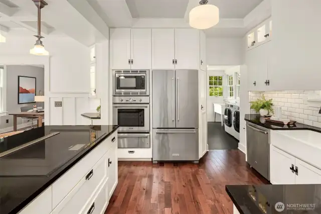 Induction stove with down draft, gorgeous high end appliances, custom lighting, farmhouse sinnk, custom cabinets and upgraded wiring and plumbing.