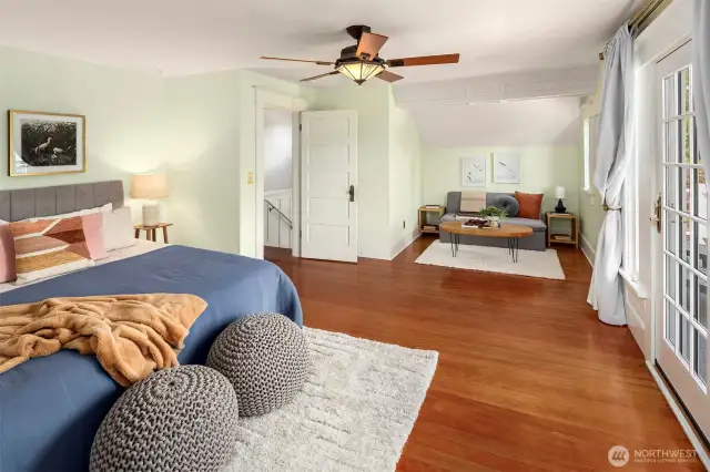One of the three large and light bedrooms on the top floor. This room has a deck that looks to the east. The morning light is sublime.