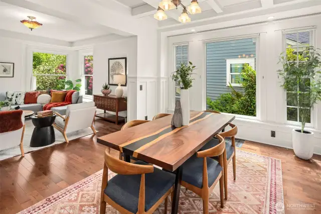 Another view of the living room and dining room that are adjacent to your stunning kitchen!
