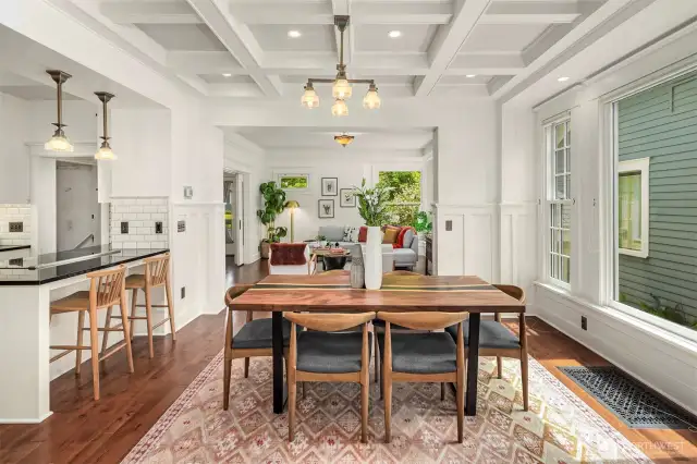 Another view of the gorgeous dining room and a sneak peek into the stunning kitchen!