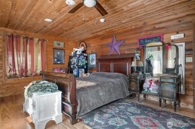 Main floor bedroom with vanity and west facing mountain views