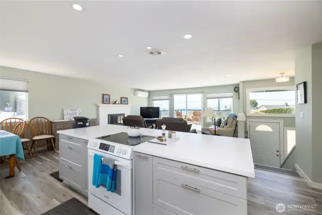 Kitchen island features range, plenty of cabinetry and room for eating