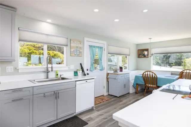 Updated kitchen featuring stylish gray cabinetry
