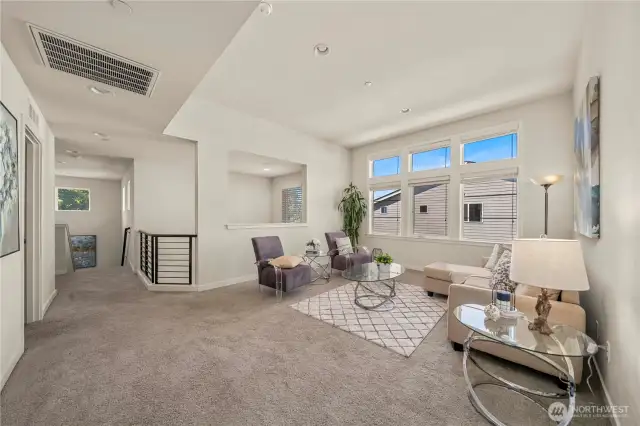Versatile upstairs loft – perfect for a home office, media room, or play area