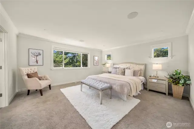 Upstairs primary suite with spa-inspired 5-piece bath and spacious walk-in closet