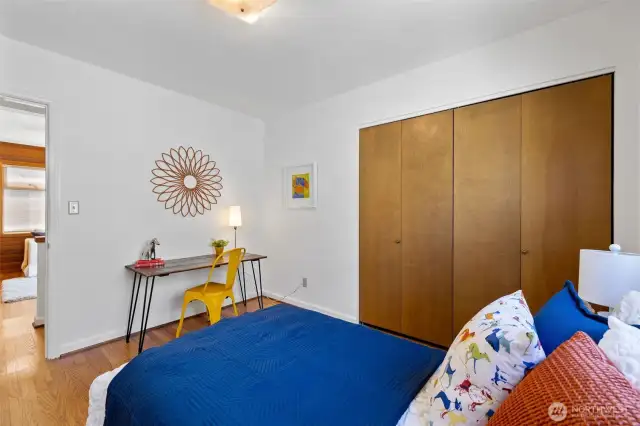 View of second bedroom looking toward hall and family room.