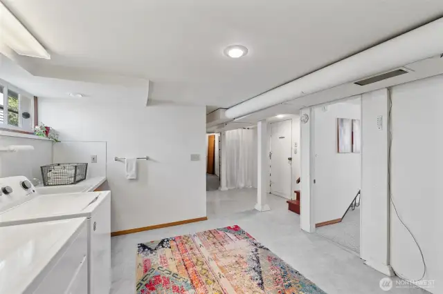 View showing access to garage, stairs to main level, and 3rd bedroom.