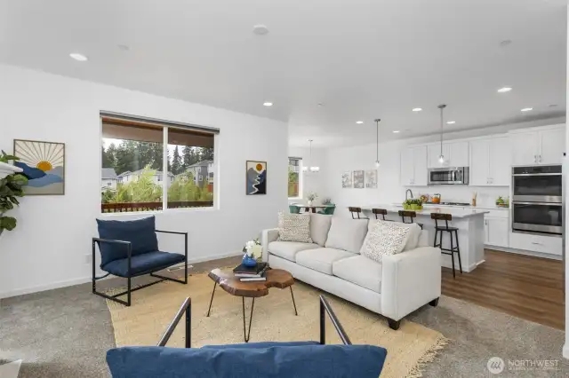 Large living room on main level, open floorplan, natural gas fireplace.