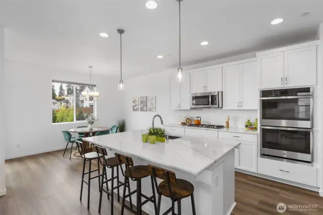 Gorgeous kitchen featuring Quartz countertops, stainless appliances and tons of storage!