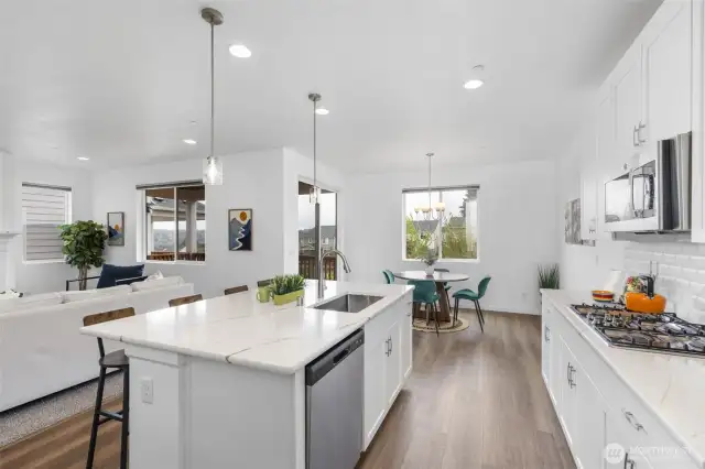 Kitchen flows to the dining room.