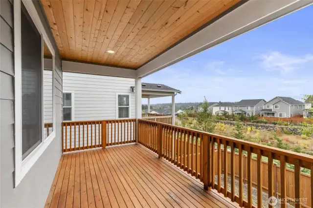 Large deck for entertaining or relaxing. At night you can see the lights from Seattle in the distance.