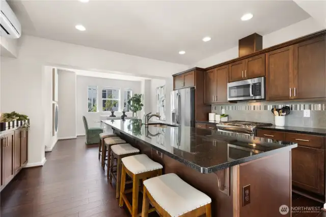 Open kitchen with massive island that can accommodate seating for 5.
