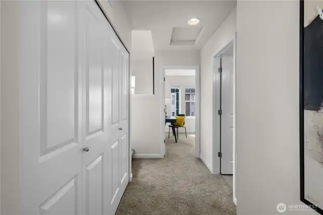 Convenient upstairs laundry is in the utility closet to the left, right by the primary suite & 2nd bedroom.
