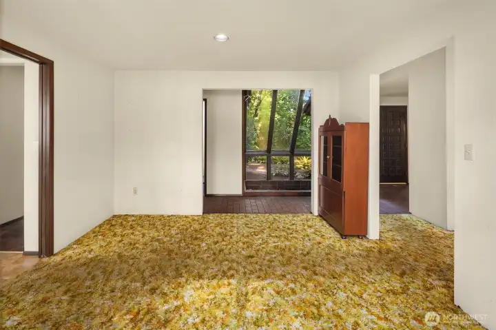 Dining room with powder room in hallway