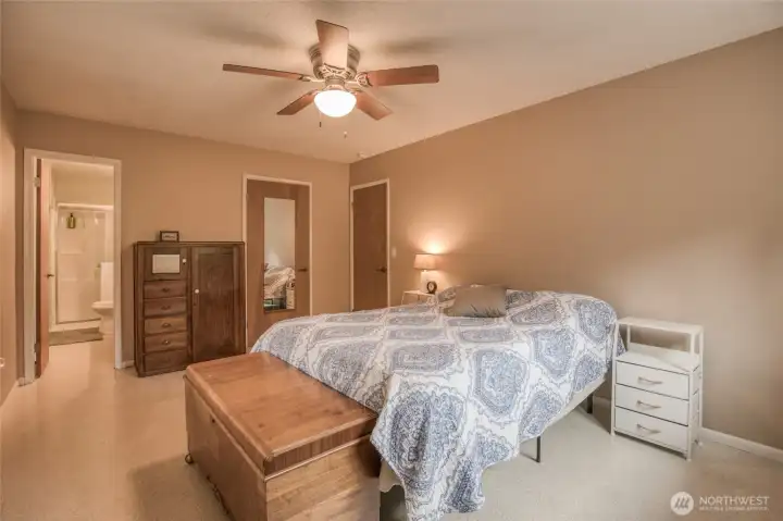 Primary bedroom with attached bathroom