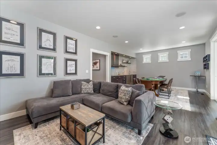 Main floor Media Room with high-end electronics and game table and bar kitchenette.