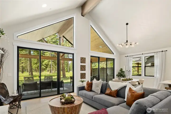 Bright open, and inviting living room with large beam.