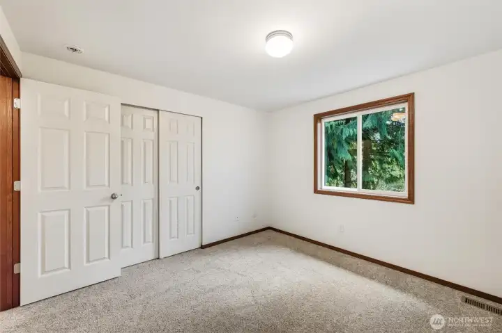Guest bedrooms have green outlooks and fresh carpet and paint for your enjoyment.