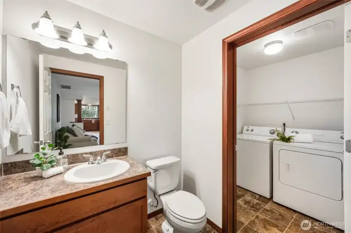 The laundry room is just off the half bathroom on the main floor. The ease of location comes off the garage creating a drop zone as you enter the house.