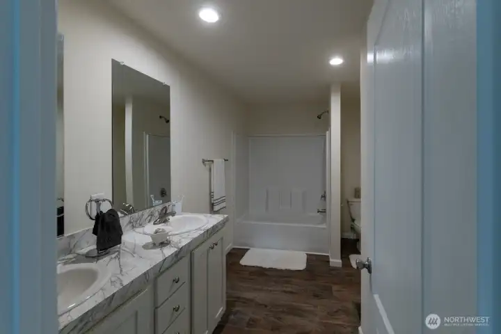 Primary bath with dual sinks and tub with shower