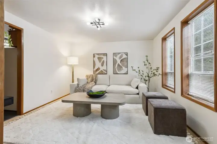 Cozy second living space with soft natural light, modern décor, and a comfortable layout—ideal for relaxing, reading, or versatile everyday use.